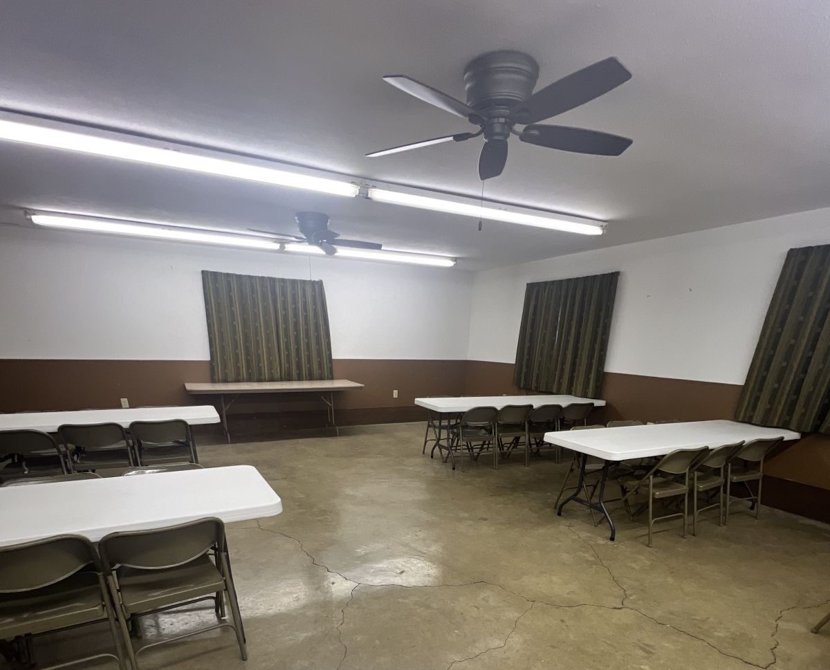 Tables and Chairs set up inside of Park Shelterhouse building